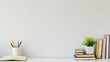 © Larysa - Workspace - office table, empty desk with books and supplies against the white wall, copy space for text or product showcase