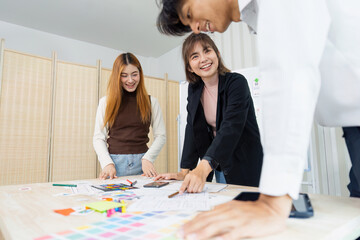 Wall Mural - team of UI UX web designer are working together to develop mobile responsive websites with UI UX front end designer previews