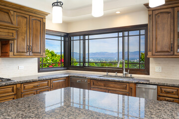 Wall Mural - Kitchen island with granite countertops and counters in modern kitchen in Encino, California