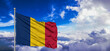 Chad national flag cloth fabric waving on beautiful Blue Sky Background.