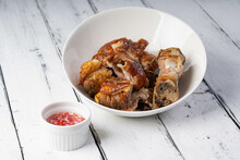 Crispy Pata Or Deep Fried Pork Leg With A Sweet White Vinaigrette Sauce, It Is A Well Known Food In The Philippines 