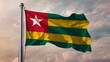 Togo Waving Flag Against a Cloudy Sky