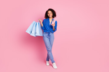 Poster - Photo of lovely charming cheerful girl dressed stylish blue clothes empty space isolated on pink color background