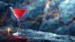 A cosmopolitan cocktail on the rocks with a blue background.