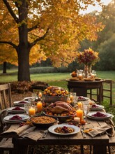 Sumptuous feast laid out on rustic wooden table, surrounded by warm hues of autumn leaves that paint serene, inviting atmosphere. Golden rays of setting sun filter through trees.