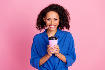 Poster - Photo of adorable pretty woman wear stylish blue clothes hold cup tasty coffee espresso isolated on pink color background