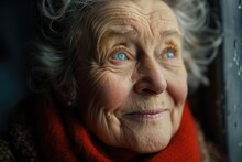 A Senior Woman In A Red Scarf Looking Out Of A Window. Suitable For Lifestyle And Elderly Care Concepts