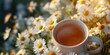 A cup of tea resting on a field of flowers. Perfect for nature or relaxation concepts