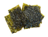 Fototapeta  - Crispy nori seaweed isolated on white background. Japanese food nori. Dry seaweed sheets.