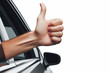 hand sticking out of the car window showing thumbs up isolated on a white background