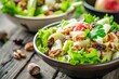 Focus on the front of a fresh Waldorf Salad with lettuce apple celery walnuts raisins and mayonnaise