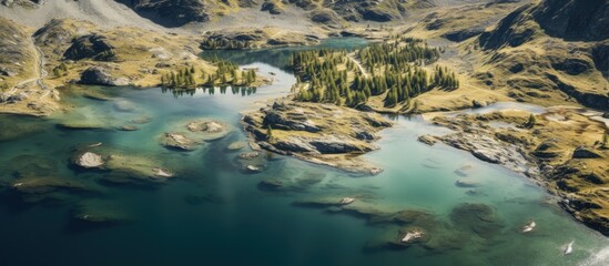 Sticker - Mountain lake amidst trees and peaks