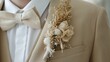 Wedding boho style boutonniere close up, groom in beige suit with bow-tie