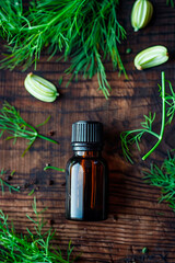 fennel essential oil in a bottle. Selective focus.