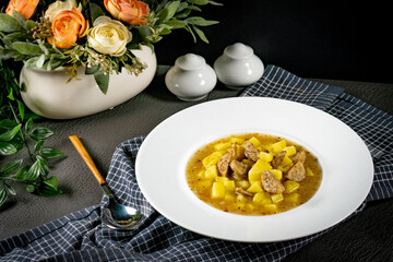 Canvas Print - Borscht with potato and white sausage.