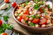 Bean salad with cherry tomatoes onion and parsley on wooden background Vegan and healthy