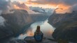 Women of Norway. Women of the World. A person sits peacefully atop a mountain overlooking a stunning fjord at sunset  #wotw
