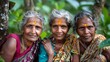 Women of Sri lanka. Women of the World. Three elderly women with traditional forehead markings pose together in a lush green setting.  #wotw