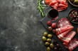 © LimeSky - Top view banner of antipasto assorted sliced meats olives and wine on stone table