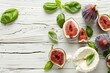 Goat cheese with figs and basil on white table flat lay Room for text