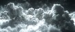   A monochrome image of an assemblage of clouds with the appearance of heavy steam emanating from them