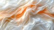   A tight shot of white and orange fabric, with a hazy representation of it fluttering in the wind