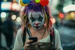 A girl in sad clown makeup looks at her phone on the street