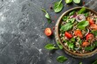 Homemade buckwheat salad with fresh ingredients served on stone background promoting a healthy diet Top view with copy space