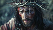 A man with a crown on his head and blood on his face. The image is dark and intense, with a sense of pain and suffering