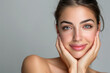 © Alienmonster Images - Portrait of a Beautiful Young Woman with a Flawless Complexion and Copy Space on Gray Background