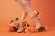 high heels with floral decoration on a peach background for fashion concept