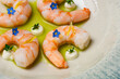 Gourmet meal shrimps in green herb oil