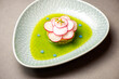 Gourmet meal with radish with green oil