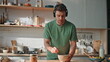 © stockbusters - Funny guy cooking meal in earphones dancing kitchen closeup. Man listening music