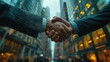 © Denys - Business handshake in urban setting