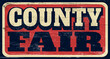 Aged and worn retro county fair sign on wood