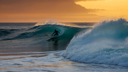 Sunset surfing in Tahiti 