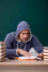 Sticker - Young male student sitting in the classroom