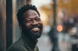 © Igor - Portrait of a smiling african american man in the city
