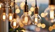 Closeup of hanging modern LED light bulbs with blurry bokeh background. Warm lighting, nice, cozy atmosphere, evening time

