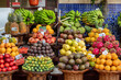 Mounds of Colorful Fruits - Bananas, Avocados, Dragon Fruit, Tomatoes, in an Outdoor Market in Funchal, Madeira, Portugal 