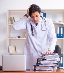 Sticker - Young handsome doctor working in the clinic