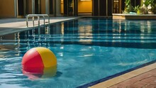 A Red And Yellow Ball Is Floating In A Pool