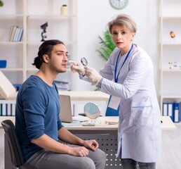 Wall Mural - Young patient visiting doctor in hospital