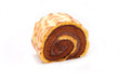 Tiger skin swiss roll cake isolated on white background. Bakery product photography
