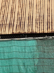 Canvas Print - old aluminum wall with green net