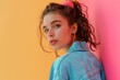 © MediaRaw - A woman in a blue jacket with a pink headband