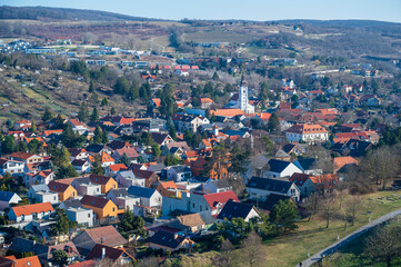 Wall Mural - View of the houses in the valley and the white church. Autumn. Sunny weather.