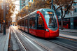 modern red tram on the city street
