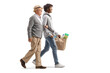 Young african american man walking with a senior caucasian man and carrying grocery bags